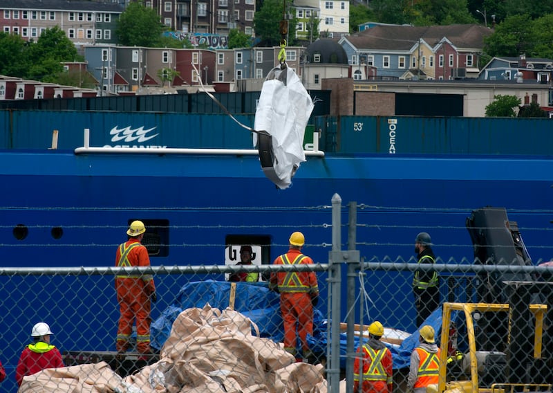 Crews in Canada unload the wreckage of the Titan submersible