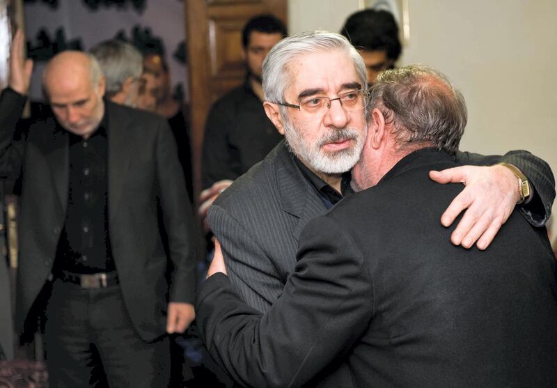 Iranian opposition leader Mir Hossein Mousavi (C) receives condolences for the death of his nephew Seyed Ali Habibi-Mousavi, on December 28, 2009 in Tehran. The 35-year-old nephew of Mir Hossein Mousavi was shot dead in Tehran during protests on December 27 which turned into the bloodiest showdown between opposition protesters and security forces in months. Iranian police said on December 29 that "terrorists" killed the nephew of opposition leader Mir Hossein Mousavi in an incident unrelated to anti-government riots at the weekend.
AFP PHOTO/ARASH ASHOURINIA / AFP PHOTO / Arash Ashourinia