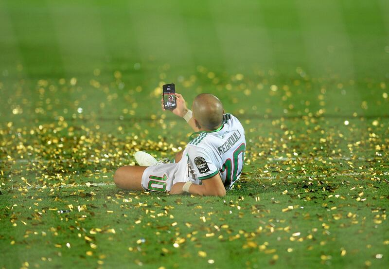 Algeria's midfielder Sofiane Feghouli celebrates after winning the 2019 Africa Cup of Nations. AFP