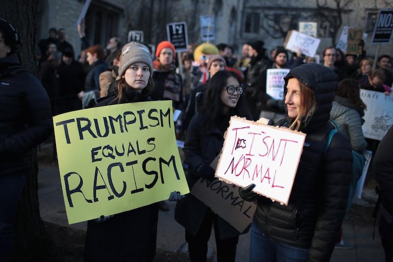 Demonstrators protest a visit by Corey Lewandowski, President Donald Trump's former campaign manager, at the University of Chicago on February 15, 2017 in Chicago, Illinois. Lewandowski was invited to the campus to participate in a seminar presented by U. of C.'s Institute of Politics.  AFP