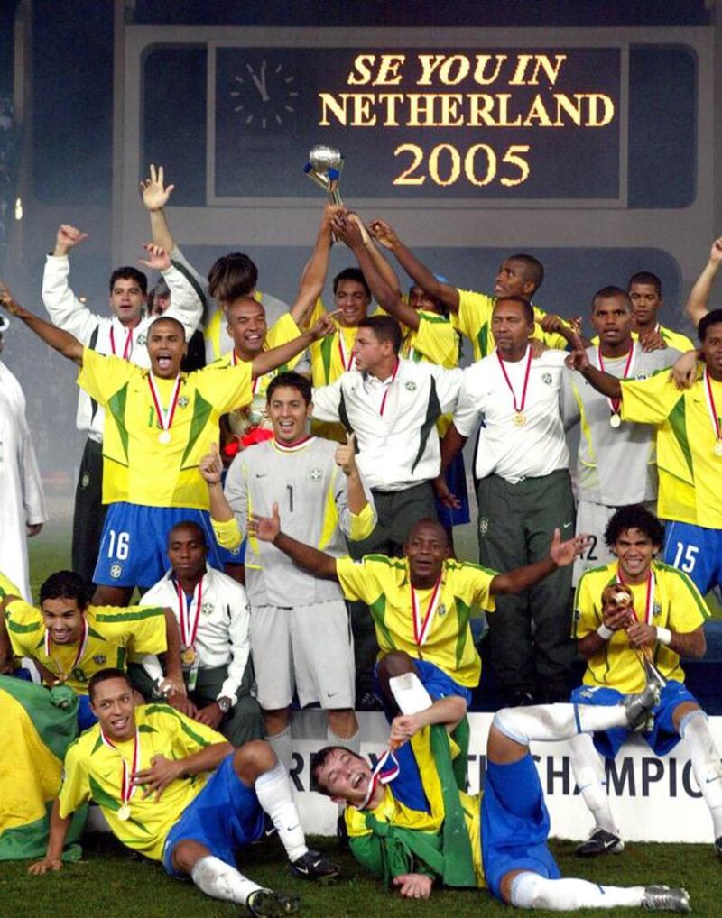 Brazilian players pose for a picture after winning the final of the 2003 Fifa World Youth Championship against Spain at Zayed Sports City Stadium in Abu Dhabi. Karim Jaafar / AFP / December 19, 2003