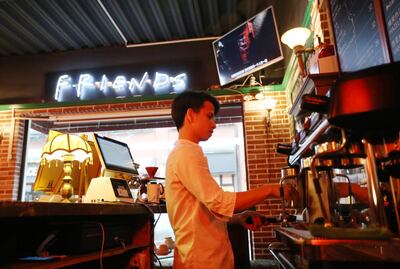This photo taken on April 23, 2018 shows a staff member making coffee at the "Central Perk" coffee shop in Shanghai.
Millions of Chinese "Friends" fans are heartbroken after a video site pulled the US sitcom, beloved by millennials in China for its endearing young characters and as an English conversation resource. / AFP PHOTO / - / China OUT / TO GO WITH China-US-entertainment-internet-Friends,FOCUS by Albee ZHANG