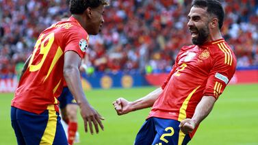 Dani Carvajal of Spain (R) celebrates scoring the 3-0 with Lamine Yamal of Spain during the UEFA EURO 2024 group B match between Spain and Croatia in Berlin, Germany, 15 June 2024.   EPA / CLEMENS BILAN