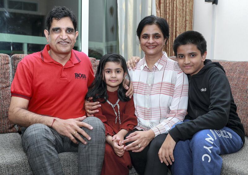 Abu Dhabi, United Arab Emirates, February 4, 2021.  Dr. Yogesh Shastri with his wife Sarika and children, Paraa-7, and Art-12.
Victor Besa/The National
Section:  NA
Reporter:  Gillian Duncan