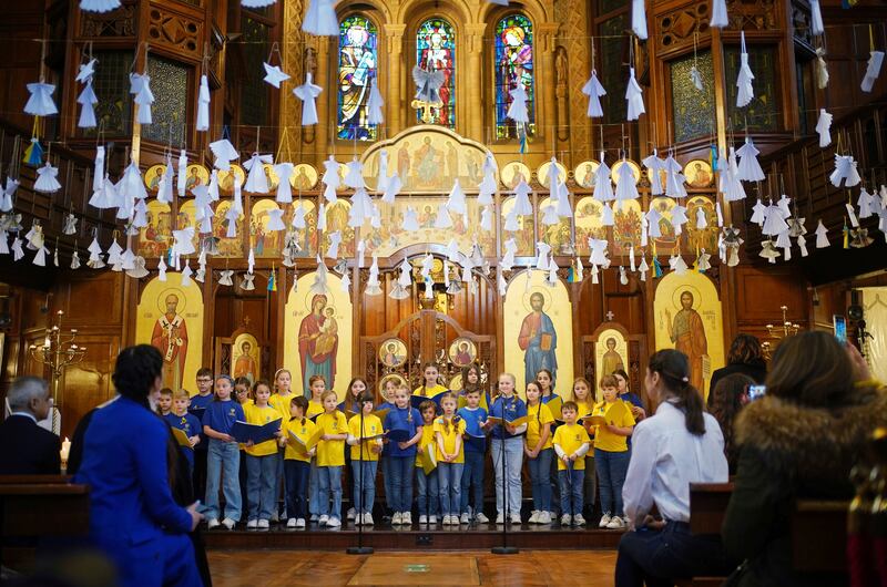 Children from St Mary's Ukrainian School choir sing the song Imagine, by John Lennon, at the Ukrainian Catholic Cathedral in London. AP