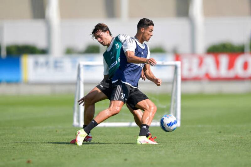 Juventus players Luca Pellegrini and Cristiano Ronaldo during a training session.