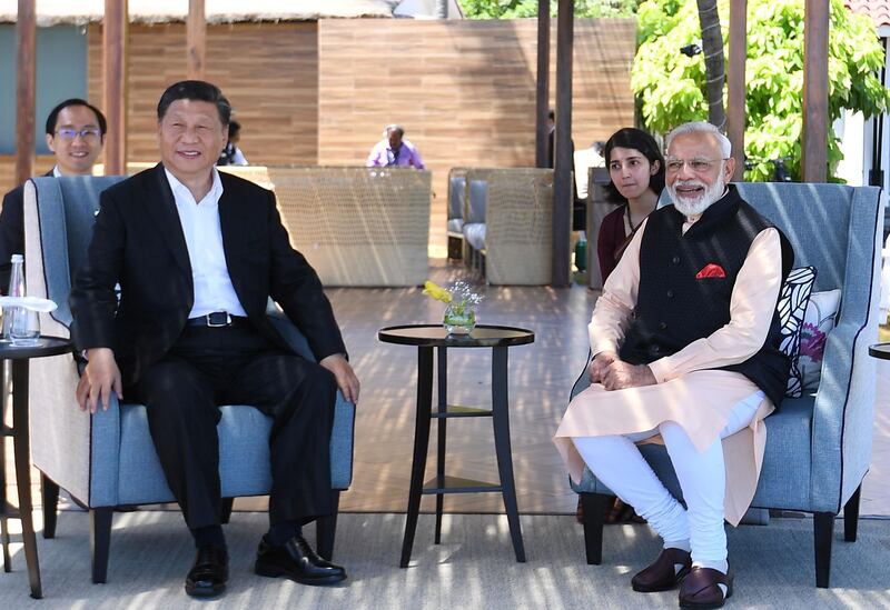 India's Prime Minister Narendra Modi and China's President Xi Jinping look on during their meeting in Mamallapuram on the outskirts of Chennai, India, October 12, 2019. India's Press Information Bureau/Handout via REUTERS  ATTENTION EDITORS - THIS IMAGE WAS PROVIDED BY A THIRD PARTY. NO RESALES. NO ARCHIVES.