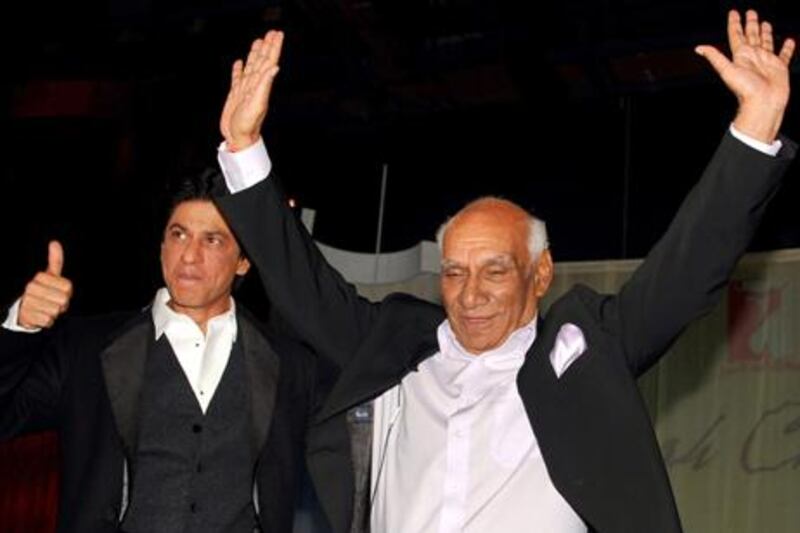 Yash Raj Chopra celebrates his 81st birthday with actor Shah Rukh Khan at a film promotion in Mumbai. AFP