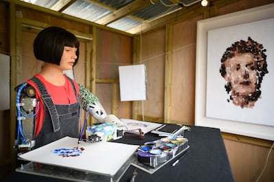 Ai-Da uses cameras in her eyes to interpret an image before painting it. Getty 
