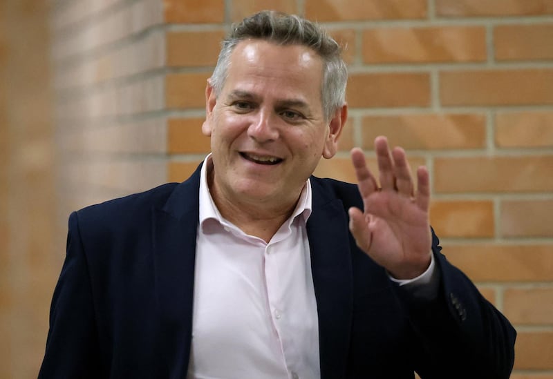 Israeli politician Nitzan Horowitz of the Meretz party waves as he arrives to attend a parliamentary meeting at the Knesset in Jerusalem, ahead of a vote on a new government, on June 13, 2021. Israel's Prime Minister Benjamin Netanyahu faces the likely end of his 12-year reign ahead of a parliament vote in which a fragile "change" coalition hopes to oust him and form a new government. / AFP / Gil COHEN-MAGEN
