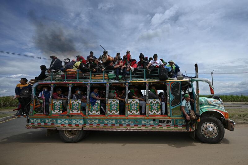 Colombian indigenous people travel on a 'chiva' bus on the Pan-American Highway in Cali, during anti-government demonstrations triggered by a now-abandoned tax reform. At least 42 people have been killed in protests. AFP