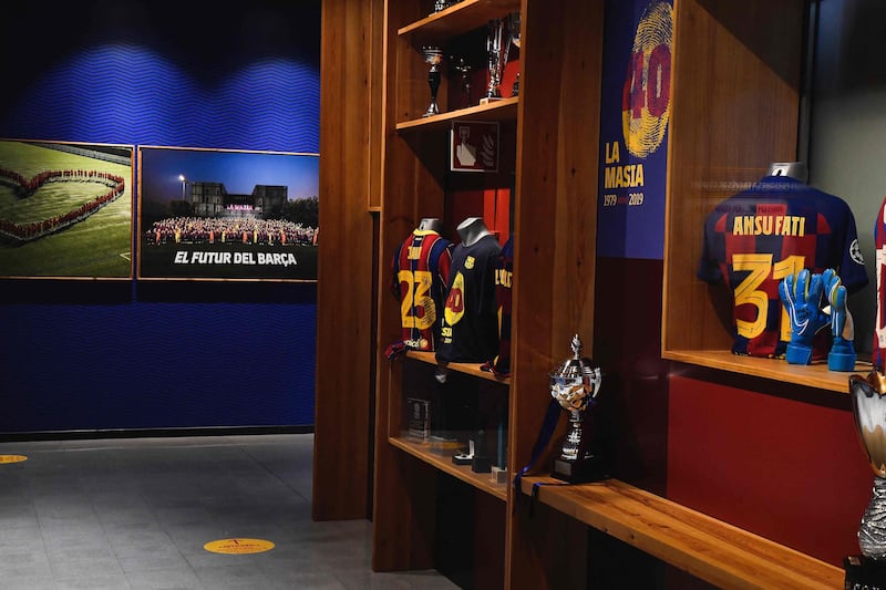 Trophies and football jerseys bearing the name of Barcelona's players are displayed at La Masia Residence, Oriol Tort Education Center, in Sant Joan Despi. AFP