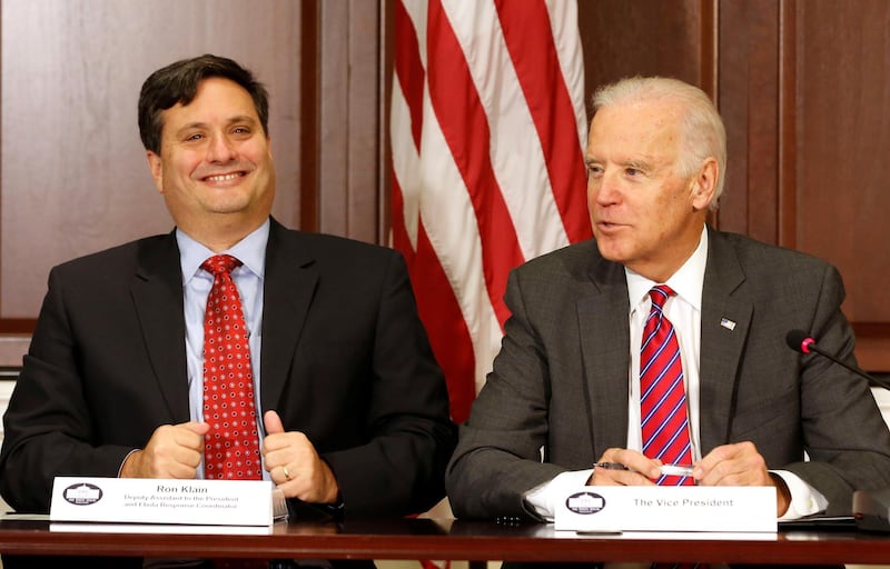 FILE PHOTO - U.S. Vice President Joe Biden (R) is joined by Ebola Response Coordinator Ron Klain (L) in the Eisenhower Executive Office Building on the White House complex in Washington, U.S. November 13, 2014.        REUTERS/Larry Downing/File Picture