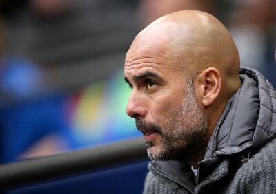 Manchester City coach Pep Guardiola sits on the bench during the English FA Cup semifinal soccer match between Manchester City and Brighton & Hove Albion at Wembley Stadium in London, Saturday, April 6, 2019. (AP Photo/Tim Ireland)