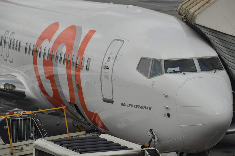 A Boeing 737 MAX aircraft operated by low-cost airline Gol is seen on the tarmac at Guarulhos International Airport, near Sao Paulo on December 9, 2020, as the 737 MAX returns into use more than 20 months after it was grounded following two deadly crashes. / AFP / NELSON ALMEIDA
