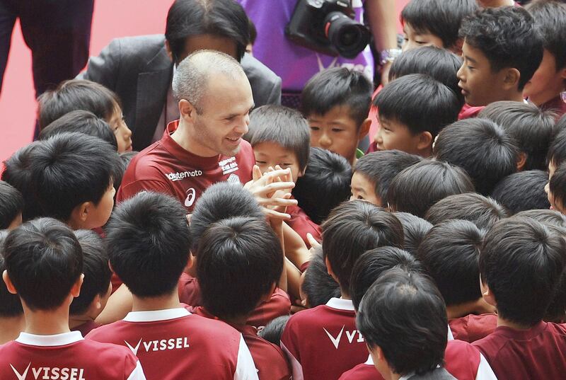 Andres Iniesta is greeted by young supporters of his new team Vissel Kobe. Reuters