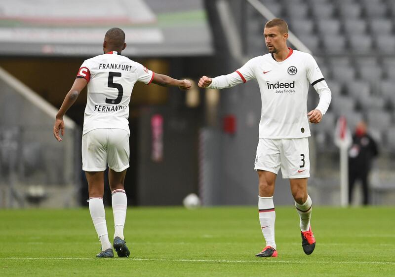 Stefan Ilsanker and Gelson Fernandes of Eintracht Frankfurt celebrate their side's first goal. Getty Images