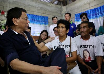 epa06553691 A handout photo made available by the Philippine Presidential Photographs Division (PPD) shows Philippine President Rodrigo Duterte (L) speaking to the parents of Overseas Filipino Worker (OFW) Joanna Demafelis during a wake in the town of Sara, Iloilo province, Philippines, 22 February 2018. Overseas domestic worker Joanna Demafelis, who was found dead, had been stuffed in an apartment's freezer in Kuwait after she died due to a severe beating. The Philippine government has banned the deployment of Filipino domestic workers to Kuwait following reports of sexual, mental, and physical abuse that has allegedly led to several deaths and injuries among migrant workers.  EPA/RICHARD MADELO-HO HANDOUT  HANDOUT EDITORIAL USE ONLY/NO SALES