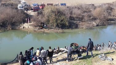 A bus carrying children on a school trip plunged into the Orontes river in north-western Syria on Thursday. AFP