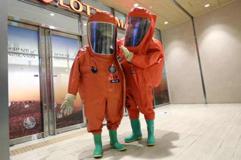 South Korean  emergency services personnel in protective clothing during an anti-terrorism and anti-chemical exercise at Lotte shopping mall in Seoul, South Korea. Getty Images