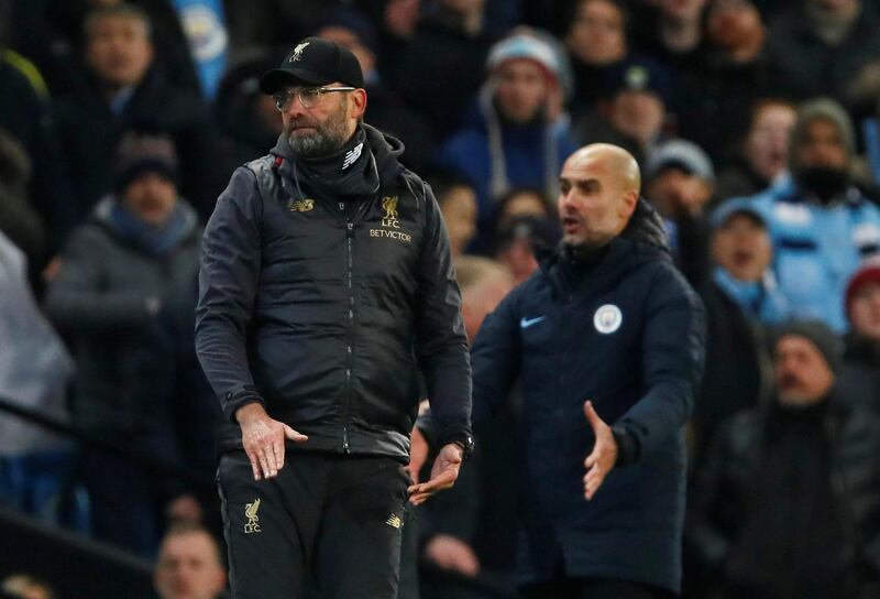 FILE PHOTO: Soccer Football - Premier League - Manchester City v Liverpool - Etihad Stadium, Manchester, Britain - January 3, 2019  Liverpool manager Juergen Klopp looks on as Manchester City manager Pep Guardiola reacts  Action Images via Reuters/Jason Cairnduff  EDITORIAL USE ONLY. No use with unauthorized audio, video, data, fixture lists, club/league logos or "live" services. Online in-match use limited to 75 images, no video emulation. No use in betting, games or single club/league/player publications.  Please contact your account representative for further details./File Photo