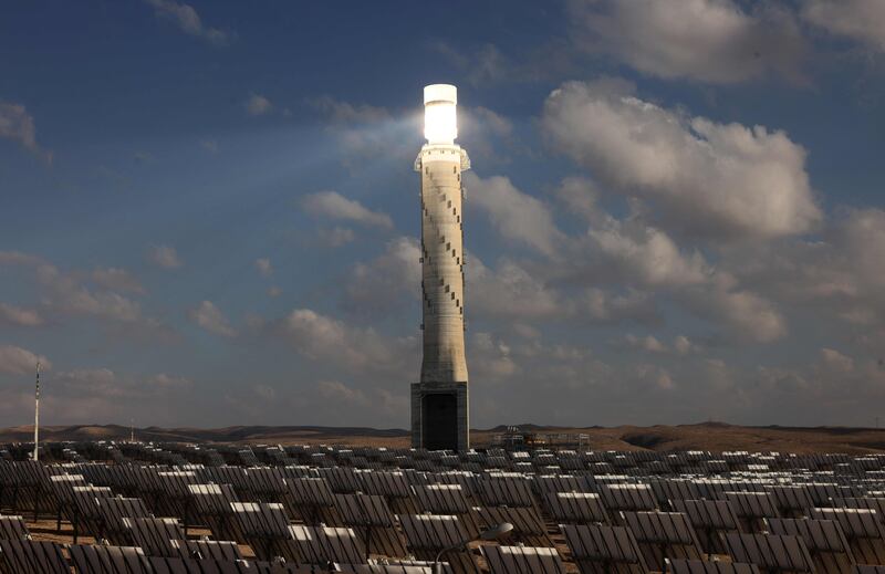 The solar tower of Israel's Ashalim power station is surrounded by solar panels in the Negev desert. Emmanuel Dunand / AFP