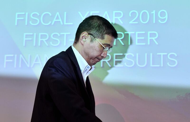 (FILES) In this file photo taken on July 25, 2019 Nissan Motors CEO Hiroto Saikawa leaves a press conference after announcing first quarter financial results at the company headquarters in Yokohama. The CEO of crisis-hit Japanese automaker Nissan admitted on September 5, 2019 he received more pay than he was entitled to but denied wrongdoing, as the firm's former chief faces financial misconduct charges. / AFP / TOSHIFUMI KITAMURA
