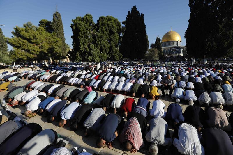 Palestinian Muslims perform the Eid Al Adha morning prayers at the Al Aqsa Mosque compound, Islam's third most holy site. AFP