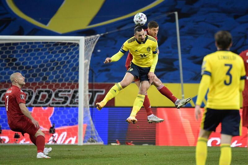 Sweden's Zlatan Ibrahimovic battles for a header with Lasha Dvali of Gerogia during the World Cup 2022 qualifier. EPA