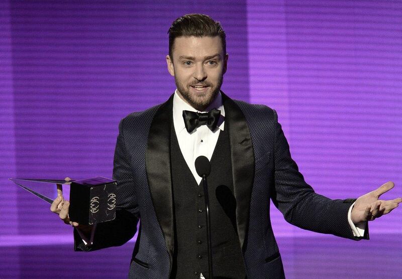 Singer Justin Timberlake accepts Favorite Pop/Rock Male Artist award onstage during the 2013 American Music Awards. Kevin Winter / Getty Images / AFP