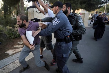 In this October 1, 2019 file photo, Israeli police push a man during a protest outside a hospital in Jerusalem where Samir Arbeed, a Palestinian suspect in a deadly West Bank bombing, is being treated. AP