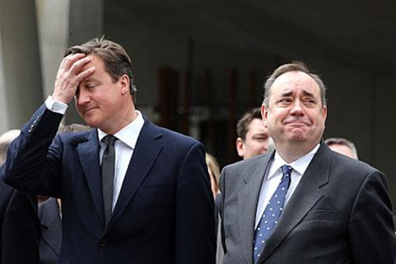 Alex Salmond, the leader of the SNP, right, has accused the UK prime minister, David Cameron, of interfering in Scottish affairs.