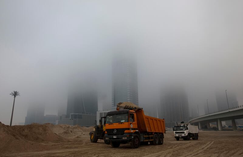  Dubai, United Arab Emirates, Jan 23 2013, Dubai stables Weather- A thick fog blanket slowly burns off  Dubai downtown area near Dubai Stables and Meydan rd 230113 . Mike Young / The National 