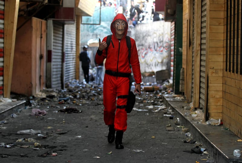 An Iraqi demonstrator wearing a red jumpsuit in the capital Baghdad, during a lull in the anti-government protests,.  AFP