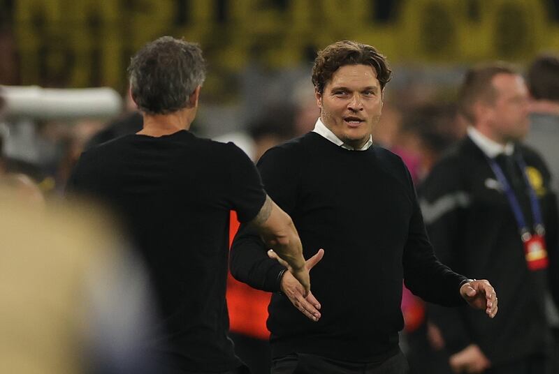 PSG manager Luis Enrique shakes hands with Dortmund manager Edin Terzic at the end of the game. EPA