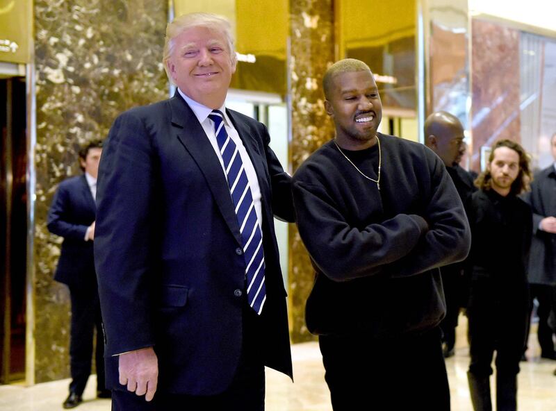 (FILES) In this file photo taken on December 13, 2016 singer Kanye West and President-elect Donald Trump speak with the press after their meetings at Trump Tower in New York. Kanye West, the entertainment mogul who urges listeners in one song to "reach for the stars, so if you fall, you land on a cloud," announced SJuly 4, 2020, he is challenging Donald Trump for the US presidency in 2020. / AFP / TIMOTHY A. CLARY

