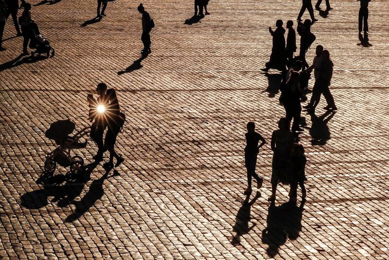 People walk on Red Square in front of the Kremlin in downtown Moscow, Russia. EPA