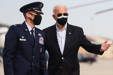 US President Joe Biden, pictured with US Air Force Col Stephen Snelson, has divided political opinion with his air strike on Iran-backed militias in Syria. Reuters