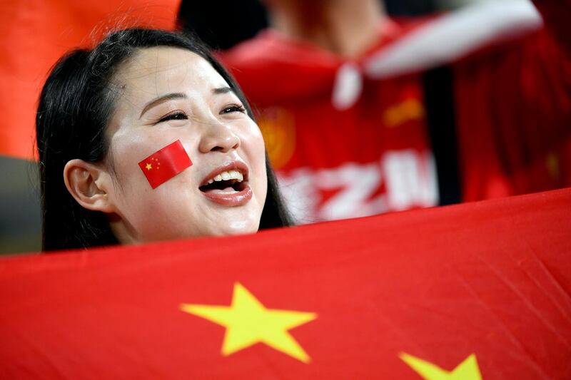 A China supporter waves the national flag during the 2019 AFC Asian Cup quarter-final football match between China and Iran at the Mohammed Bin Zayed Stadium Stadium in Abu Dhabi on January 24, 2019.  / AFP / Khaled DESOUKI
