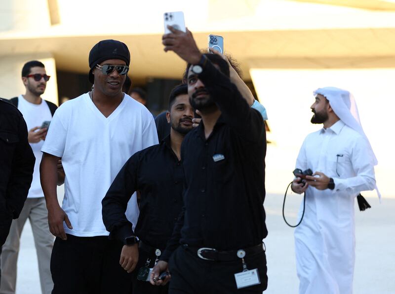 Former Brazil footballer Ronaldinho has been meeting supporters in Doha. Reuters