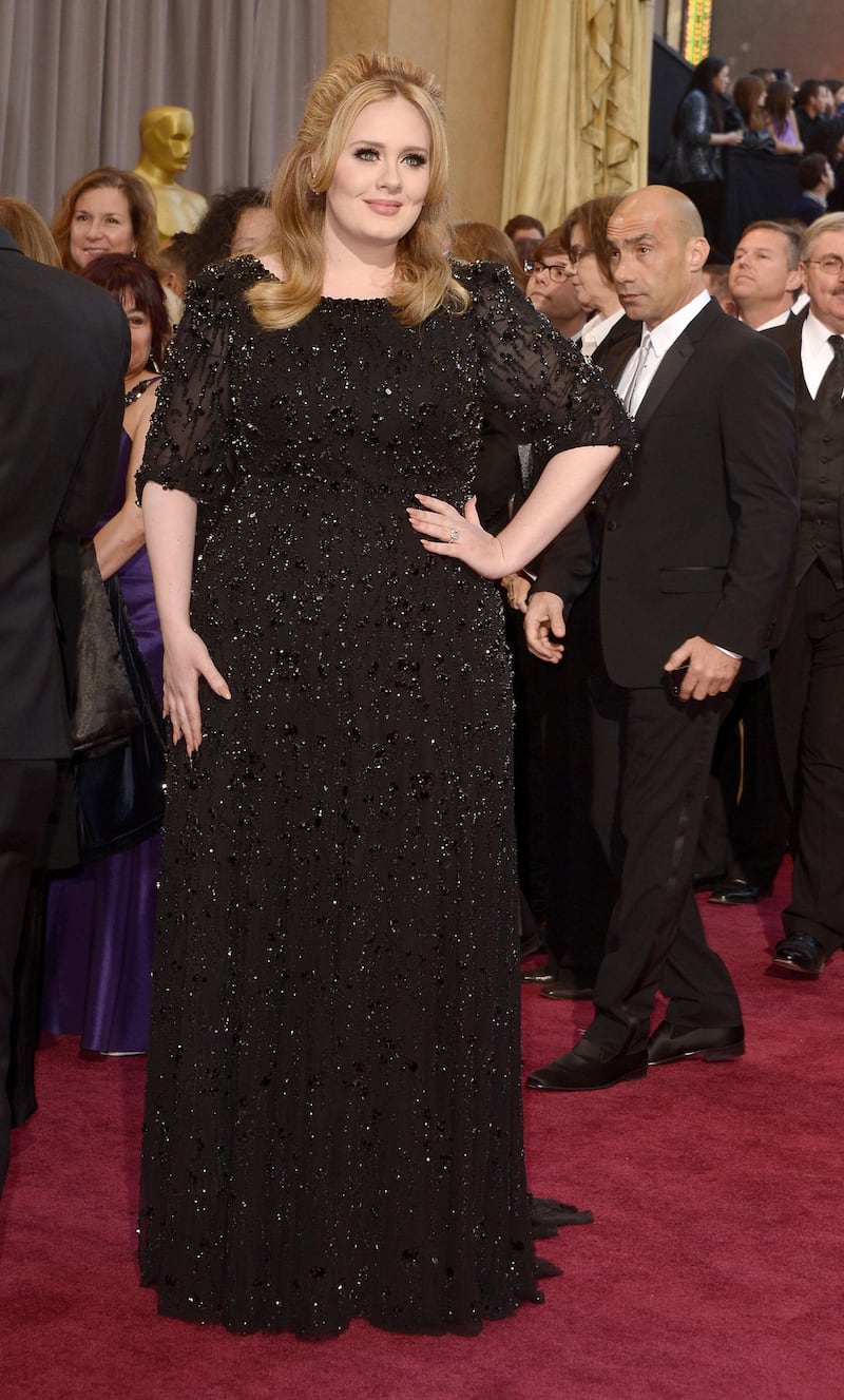 epa03599295 British singer Adele arrives on the red carpet for the 85th Academy Awards at the Dolby Theatre in Hollywood, California, USA, 24 February 2013. The Oscars are presented for outstanding individual or collective efforts in up to 24 categories in filmmaking.  EPA/PAUL BUCK