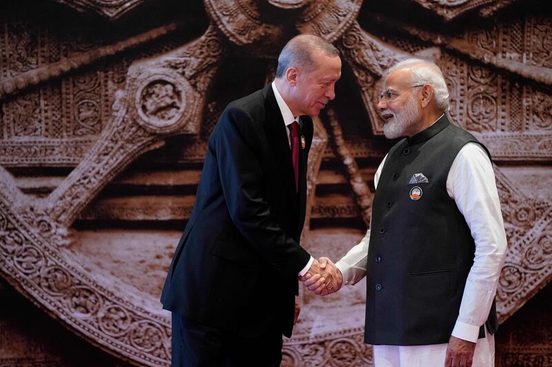 India's Prime Minister Narendra Modi greets Turkey's President Recep Tayyip Erdogan. AFP