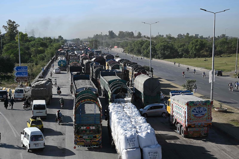 A motorway leading into Islamabad is blocked by supporters of Mr Khan as they protest against his arrest. AFP