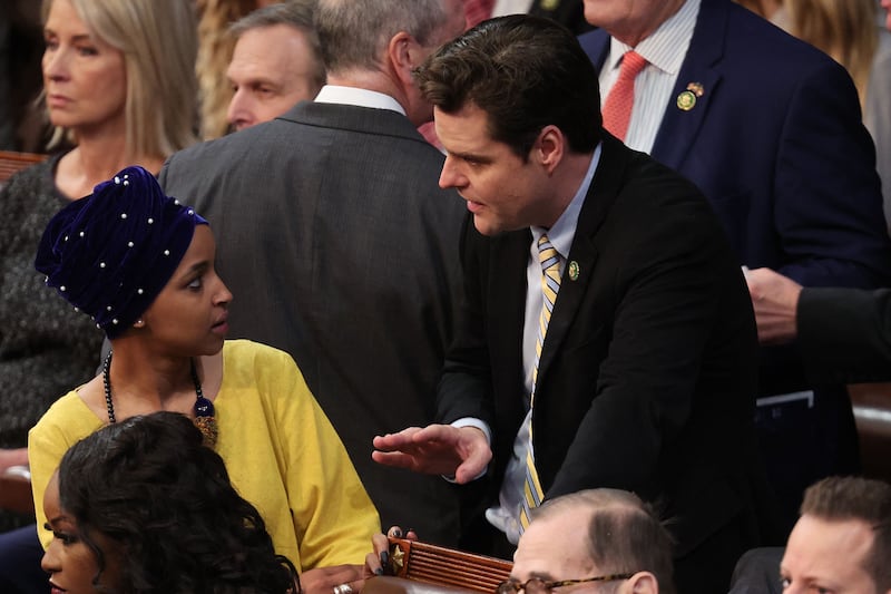 Ms Omar speaks with Republican Matt Gaetz during elections for speaker of the House last month. Getty / AFP
