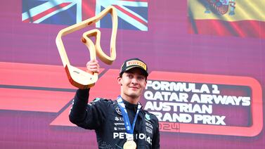 SPIELBERG, AUSTRIA - JUNE 30: Race winner George Russell of Great Britain and Mercedes celebrates on the podium during the F1 Grand Prix of Austria at Red Bull Ring on June 30, 2024 in Spielberg, Austria. (Photo by Clive Rose / Getty Images)