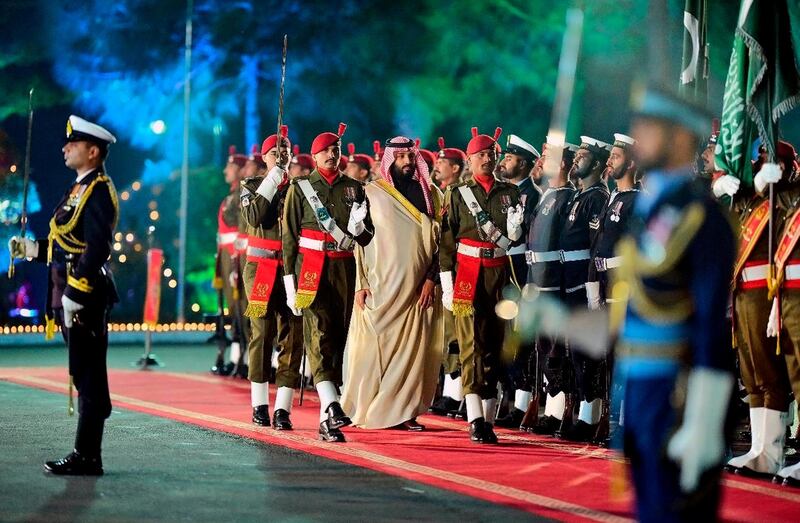 Mohammad bin Salman inspects a guard of honour in Islamabad. EPA