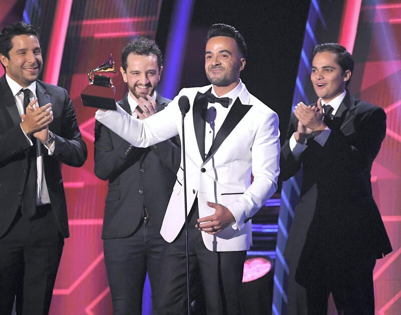 LAS VEGAS, NV - NOVEMBER 16:  Luis Fonsi (C) with producers Mauricio Rengifo, Andres Torres and Luis Saldarriaga accept Record of the Year for 'Despacito' onstage at the 18th Annual Latin Grammy Awards at MGM Grand Garden Arena on November 16, 2017 in Las Vegas, Nevada.  (Photo by Kevin Winter/Getty Images)