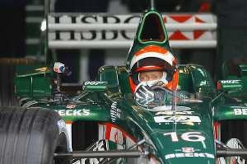 The Ford-backed Formula One Jaguar racing team boss Niki Lauda prepares to test the last season's Jaguar R2 Formula One 13 January 2002, at Valencia's racetrack. Lauda, 52, was driving a Formula One for the first time since he retired in 1985.  AFP PHOTO/PIERRE-PHILIPPE MARCOU