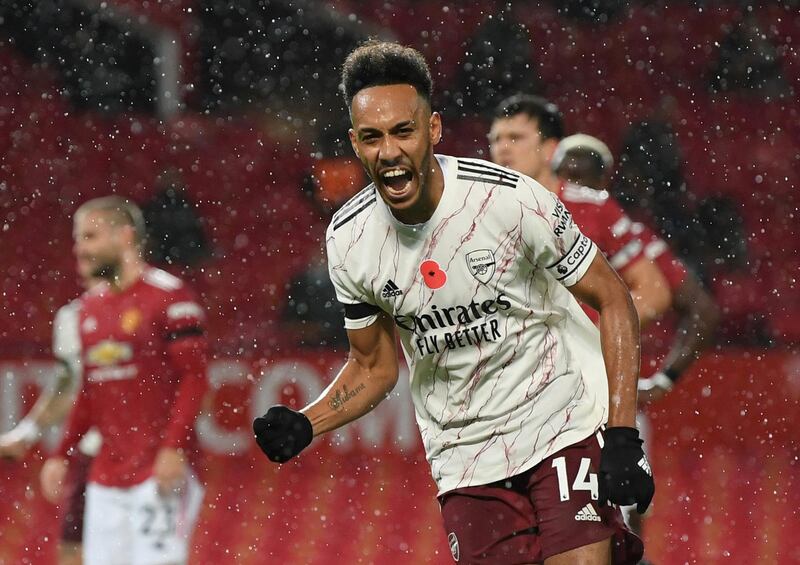 Soccer Football - Premier League - Manchester United v Arsenal - Old Trafford, Manchester, Britain - November 1, 2020 Arsenal's Pierre-Emerick Aubameyang celebrates scoring their first goal Pool via REUTERS/Shaun Botterill EDITORIAL USE ONLY. No use with unauthorized audio, video, data, fixture lists, club/league logos or 'live' services. Online in-match use limited to 75 images, no video emulation. No use in betting, games or single club /league/player publications.  Please contact your account representative for further details.