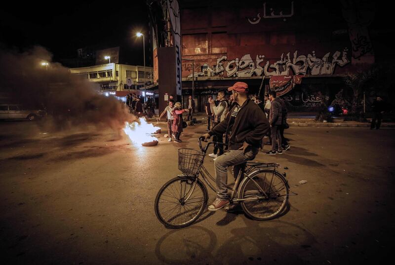 Lebanese people protest in the northern city of Tripoli on April 17, 2020 despite the country's coronavirus lockdown. AFP